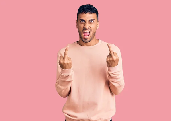 Young Hispanic Man Wearing Casual Clothes Showing Middle Finger Doing — Stockfoto