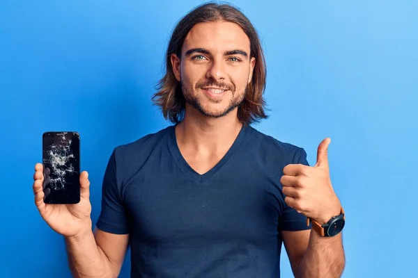 Young Handsome Man Holding Broken Smartphone Showing Cracked Screen Smiling — Stock Photo, Image