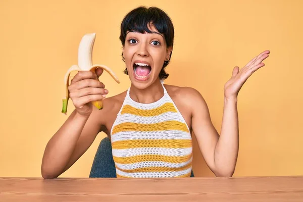 Brunette Teenager Girl Eating Banana Healthy Snack Celebrating Victory Happy — Stock Photo, Image