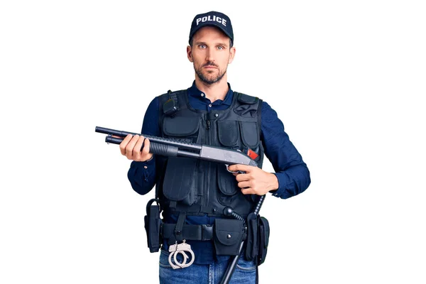 Young Handsome Man Wearing Police Uniform Holding Shotgun Thinking Attitude — Stock Photo, Image