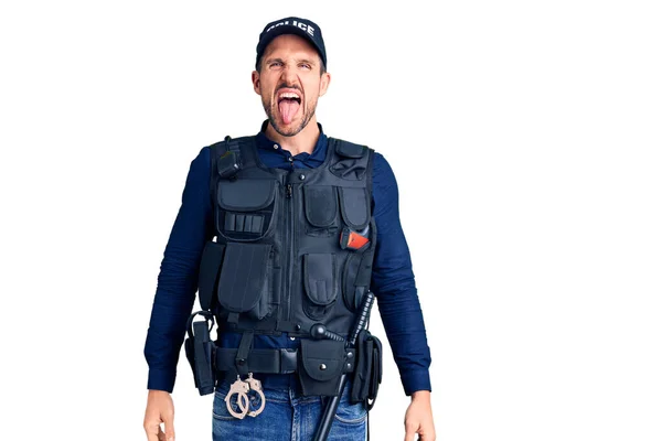 Young Handsome Man Wearing Police Uniform Sticking Tongue Out Happy — Stock Photo, Image
