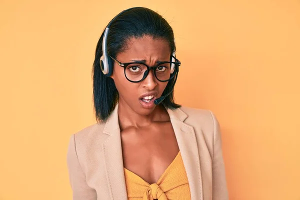 Young African American Woman Wearing Call Center Agent Headset Clueless — Stock Photo, Image