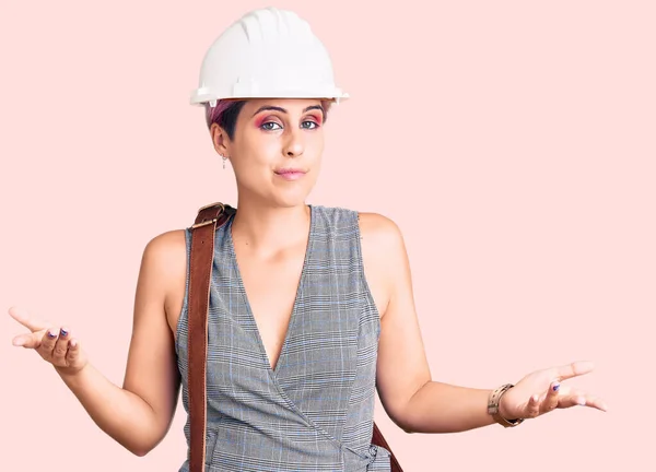 Young Beautiful Woman Wearing Architect Hardhat Leather Bag Clueless Confused — Stock Photo, Image