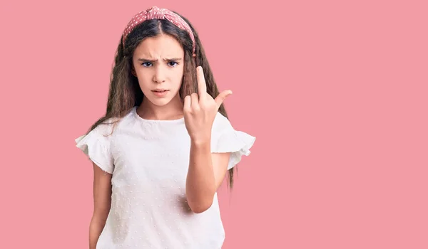 Cute Hispanic Child Girl Wearing Casual White Tshirt Showing Middle — Stock fotografie