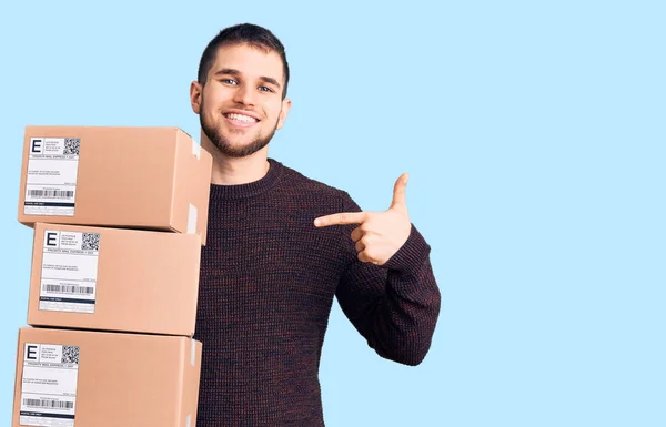 Young Handsome Man Holding Delivery Package Pointing Finger One Self — Stock Photo, Image