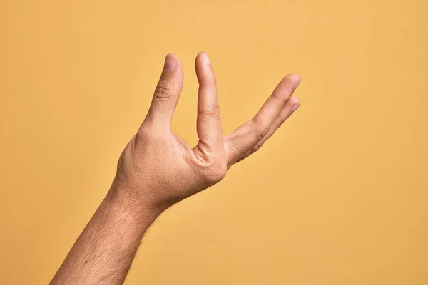 Hand Caucasian Young Man Showing Fingers Isolated Yellow Background Picking — Stock Photo, Image
