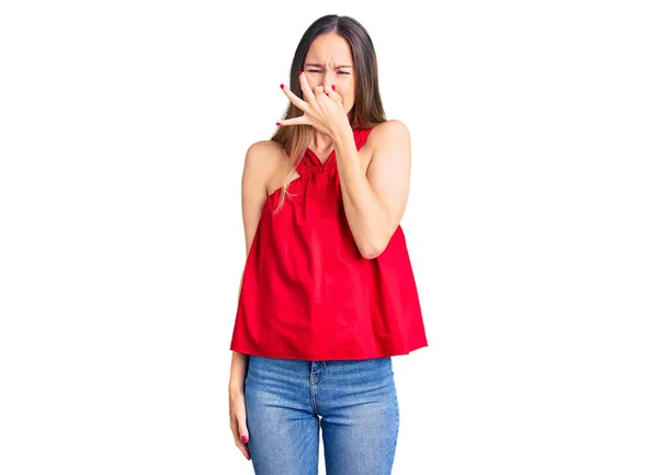 Beautiful Brunette Young Woman Wearing Casual Clothes Smelling Something Stinky — Stock Photo, Image