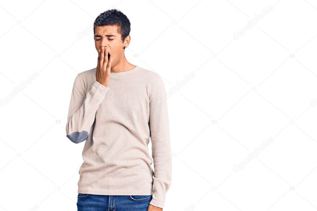 Young african amercian man wearing casual clothes bored yawning tired covering mouth with hand. restless and sleepiness. 