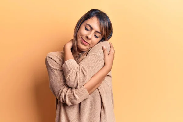 Young Beautiful Woman Wearing Casual Sweater Hugging Oneself Happy Positive — Stock Photo, Image