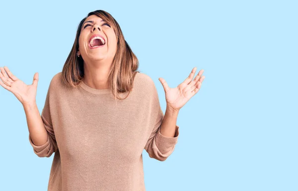 Young Beautiful Woman Wearing Casual Sweater Celebrating Mad Crazy Success — Stock Photo, Image