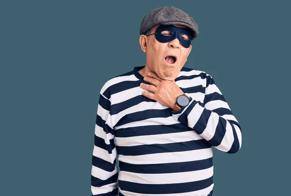 Senior Handsome Man Wearing Burglar Mask Shirt Touching Painful Neck — Stock Photo, Image