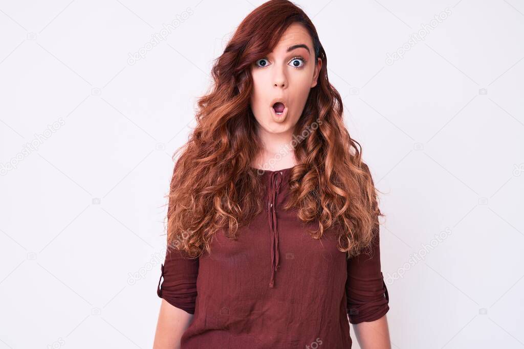 Young beautiful woman wearing casual clothes scared and amazed with open mouth for surprise, disbelief face 