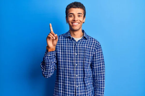 Young African Amercian Man Wearing Casual Clothes Showing Pointing Finger — Stock Photo, Image