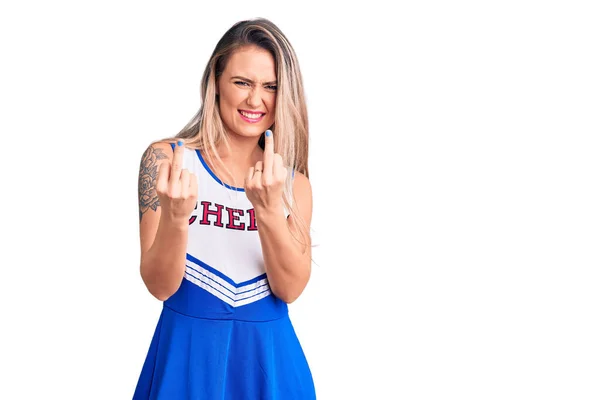 Young Beautiful Blonde Woman Wearing Cheerleader Uniform Showing Middle Finger — 图库照片