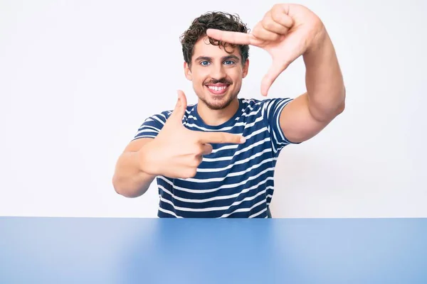 Young Caucasian Man Curly Hair Wearing Casual Clothes Sitting Table — Stock Photo, Image