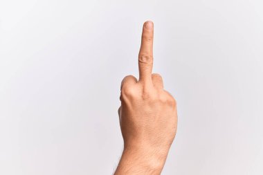Hand of caucasian young man showing fingers over isolated white background showing provocative and rude gesture doing fuck you symbol with middle finger