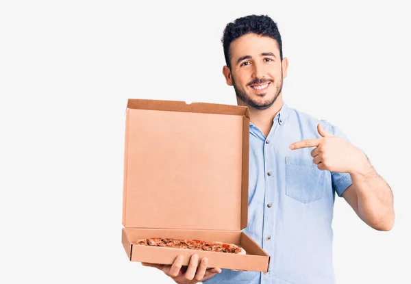 Young Hispanic Man Holding Delivery Pizza Box Pointing Finger One — Stock Photo, Image