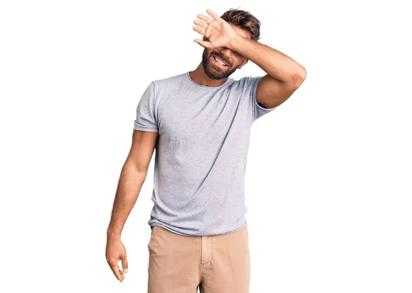 Young Hispanic Man Wearing Casual Clothes Covering Eyes Arm Smiling — Stock Photo, Image