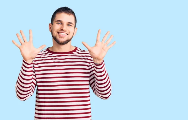 Young Handsome Man Wearing Striped Sweater Showing Pointing Fingers Number — Stock Photo, Image