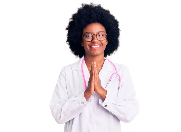 Young African American Woman Wearing Doctor Coat Stethoscope Praying Hands — Stock Photo, Image