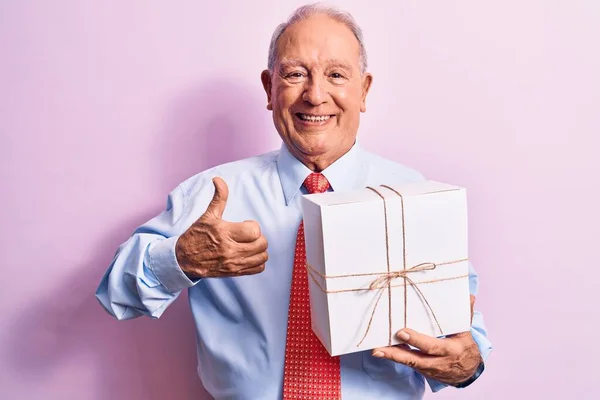 Senior Grey Haired Businessman Wearing Tie Holding Birthday Gift Pink — Stock Photo, Image