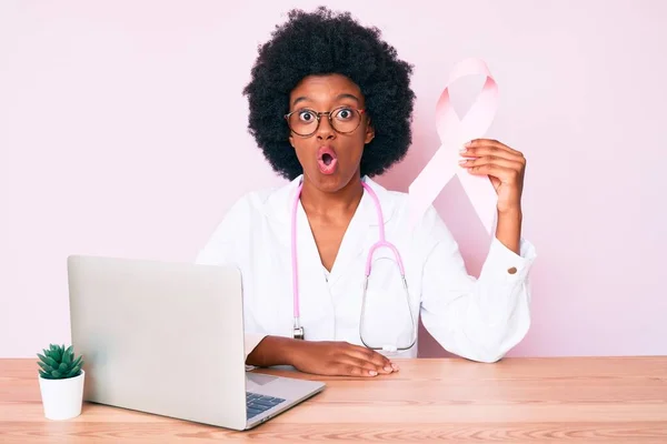 Young African American Woman Wearing Doctor Uniform Holding Pink Cancer — Stock Photo, Image