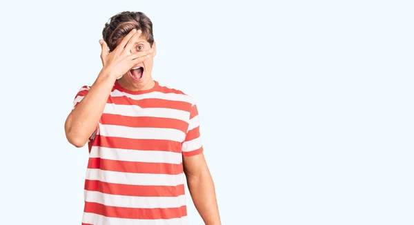 Young Handsome Man Wearing Casual Clothes Peeking Shock Covering Face — Stock Photo, Image