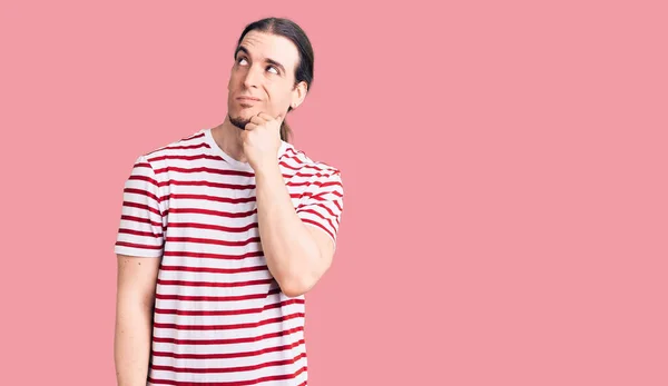 Young Adult Man Long Hair Wearing Casual Striped Tshirt Serious — Stock Photo, Image