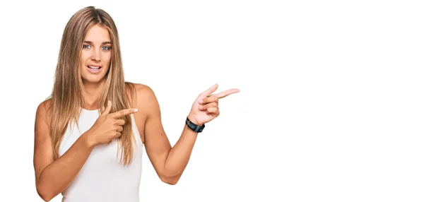 Young Blonde Woman Wearing Casual Style Sleeveless Shirt Pointing Aside — Stock Photo, Image