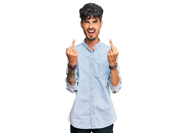 Young Hispanic Man Wearing Casual Clothes Showing Middle Finger Doing — Stockfoto