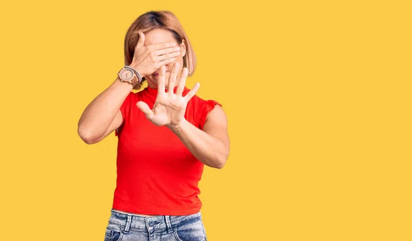 Young Blonde Woman Wearing Casual Clothes Covering Eyes Hands Doing — Stock Photo, Image