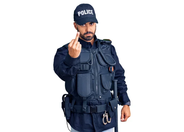 Young Hispanic Man Wearing Police Uniform Showing Middle Finger Impolite — Stock fotografie