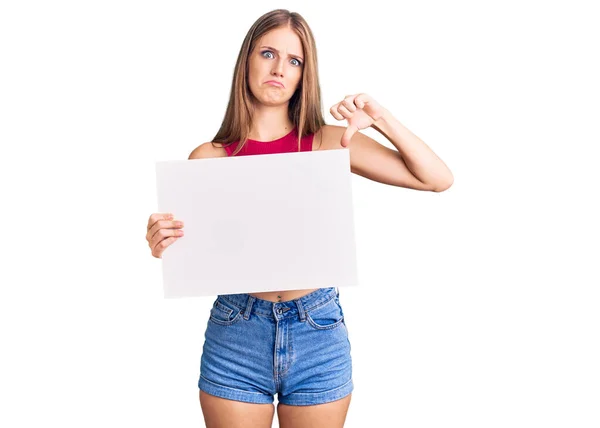 Young Beautiful Blonde Woman Holding Blank Empty Banner Angry Face — Stock Photo, Image