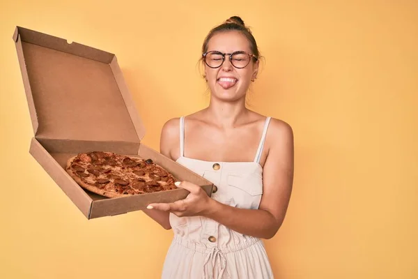Beautiful Caucasian Woman Holding Tasty Pepperoni Pizza Sticking Tongue Out — Stock Photo, Image