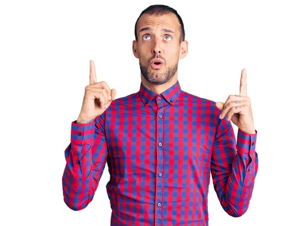 Young Handsome Man Wearing Casual Clothes Amazed Surprised Looking Pointing — Stock Photo, Image