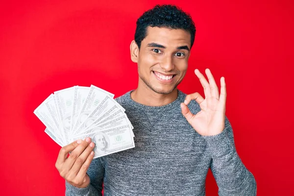 Joven Hombre Hispano Guapo Sosteniendo Bolsa Dinero Con Símbolo Del —  Fotos de Stock