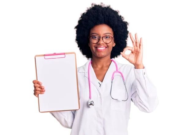 Young African American Woman Wearing Doctor Stethoscope Holding Clipboard Doing — Stock Photo, Image