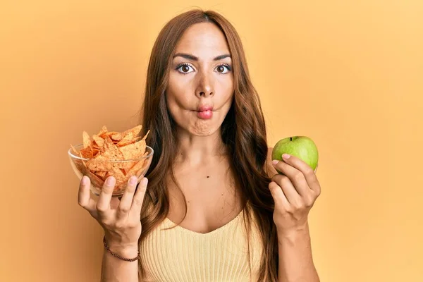 Young Brunette Woman Holding Nachos Healthy Green Apple Making Fish — Stock Photo, Image