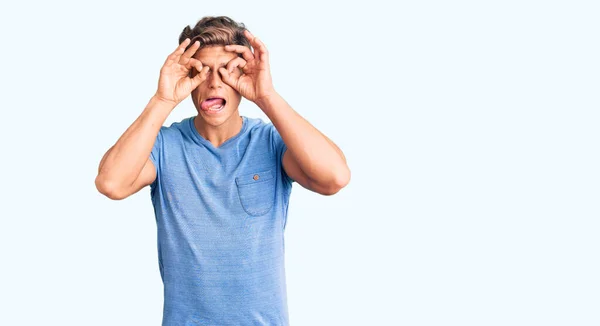 Young Handsome Man Wearing Casual Clothes Doing Gesture Binoculars Sticking — Stock Photo, Image