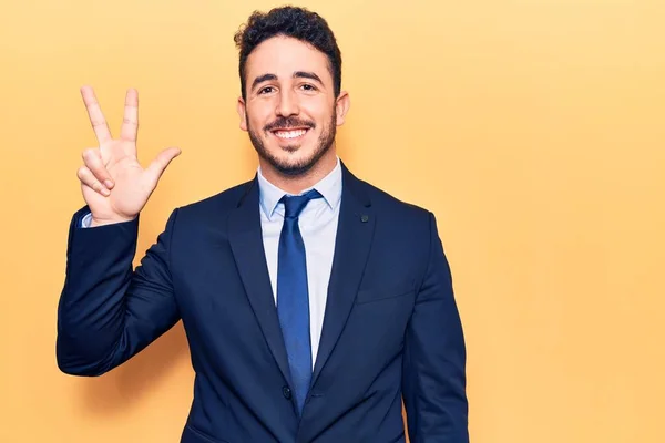 Young Hispanic Man Wearing Suit Showing Pointing Fingers Number Three — Stock Photo, Image