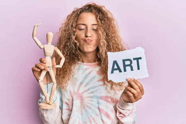 Beautiful Caucasian Teenager Girl Holding Wooden Manikin Art Word Looking — Stock Photo, Image