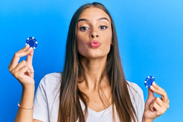 Young Hispanic Woman Holding Poker Chips Looking Camera Blowing Kiss — Stock Photo, Image