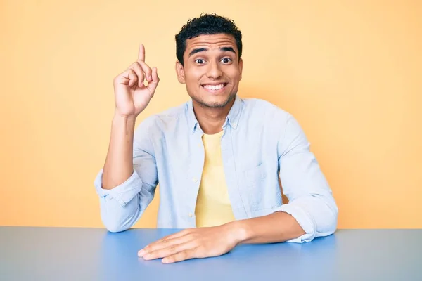 Young Handsome Hispanic Man Wearing Casual Clothes Sitting Table Pointing — Stock Photo, Image