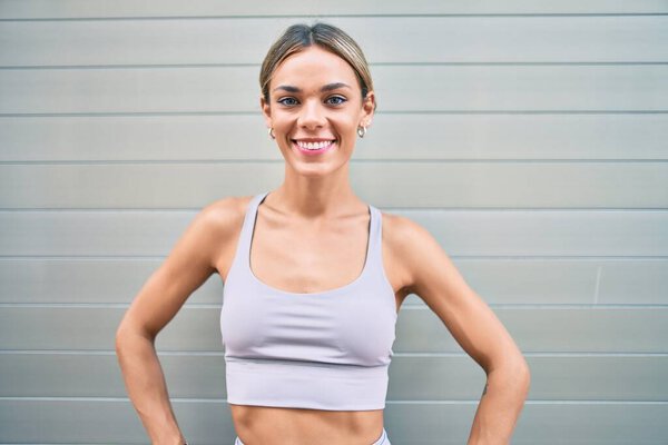 Young cauciasian fitness woman wearing sport clothes training outdoors