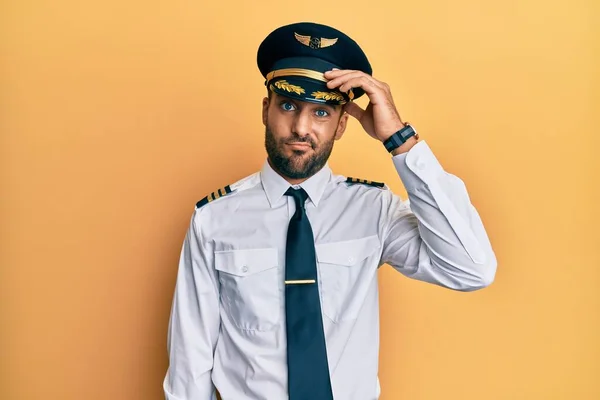 Handsome Hispanic Man Wearing Airplane Pilot Uniform Worried Stressed Problem — Stock Photo, Image