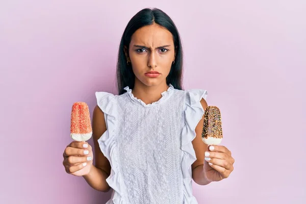 Young Brunette Arab Woman Holding Ice Cream Clueless Confused Expression — Stock Photo, Image