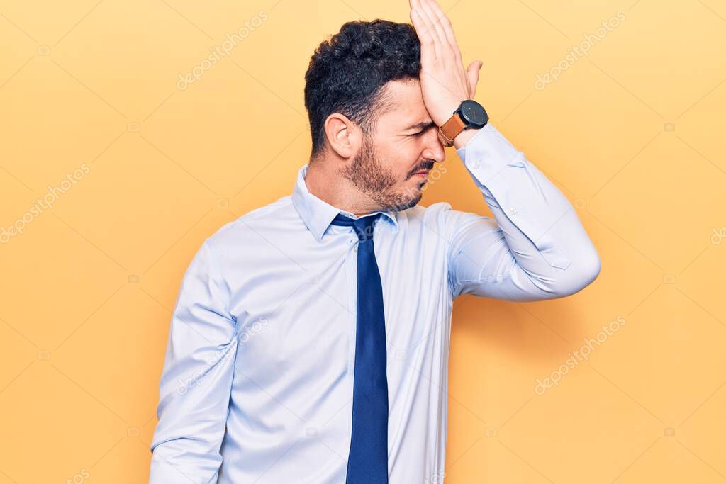 Young hispanic man wearing business clothes surprised with hand on head for mistake, remember error. forgot, bad memory concept. 