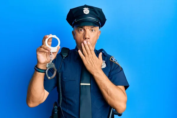 Handsome Middle Age Mature Man Wearing Police Uniform Holding Metal — Stock Photo, Image