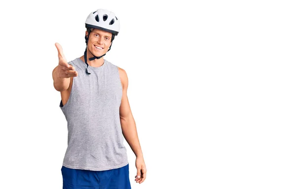 Young Handsome Man Wearing Bike Helmet Smiling Friendly Offering Handshake — Stock Photo, Image
