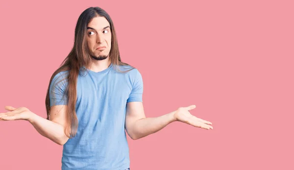 Young Adult Man Long Hair Wearing Casual Clothes Clueless Confused — Stock Photo, Image